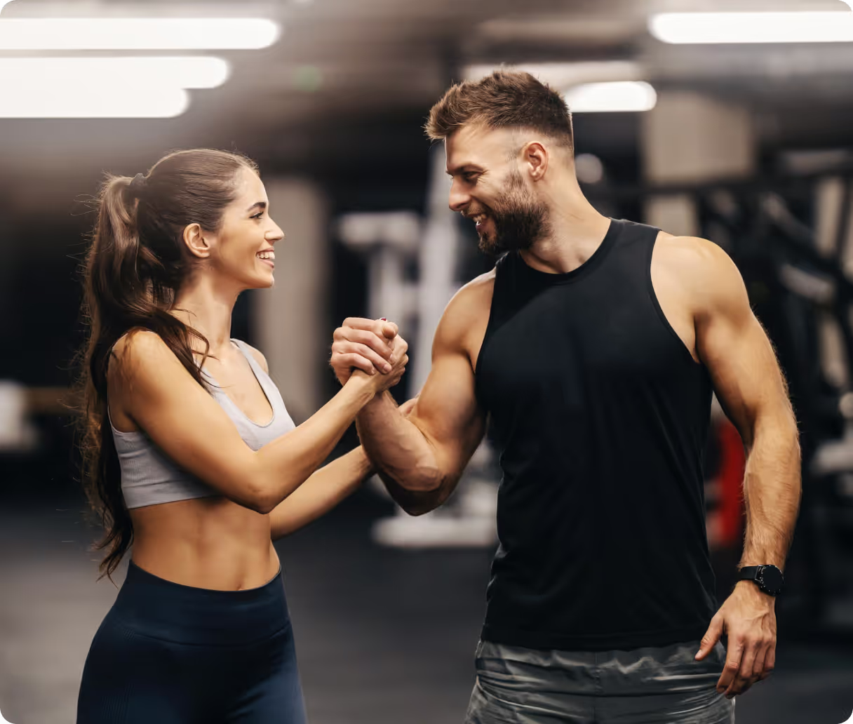Personal trainer shakes hands with client
